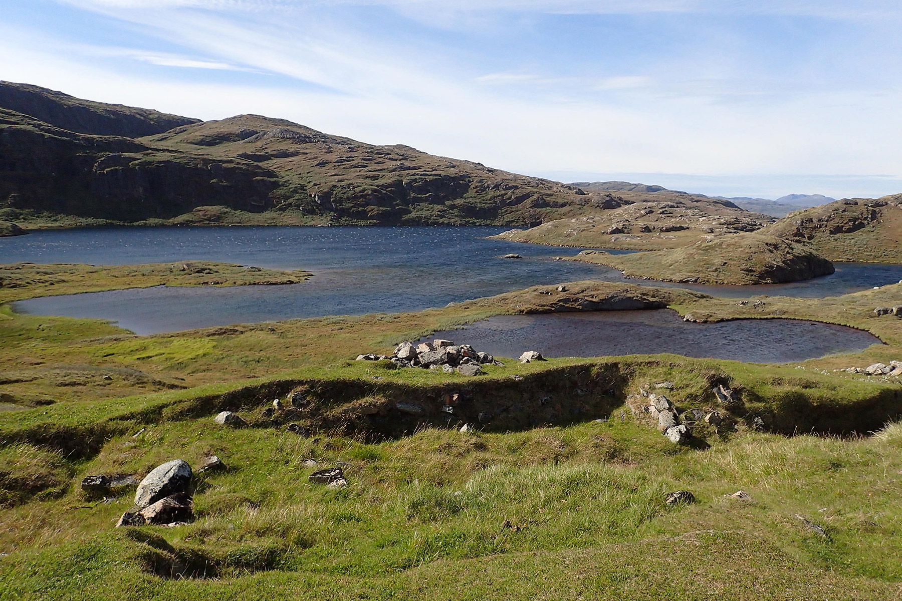 The Norse (Viking) ruin “Mountain Farm” overlooking a Greenlandic Lake.